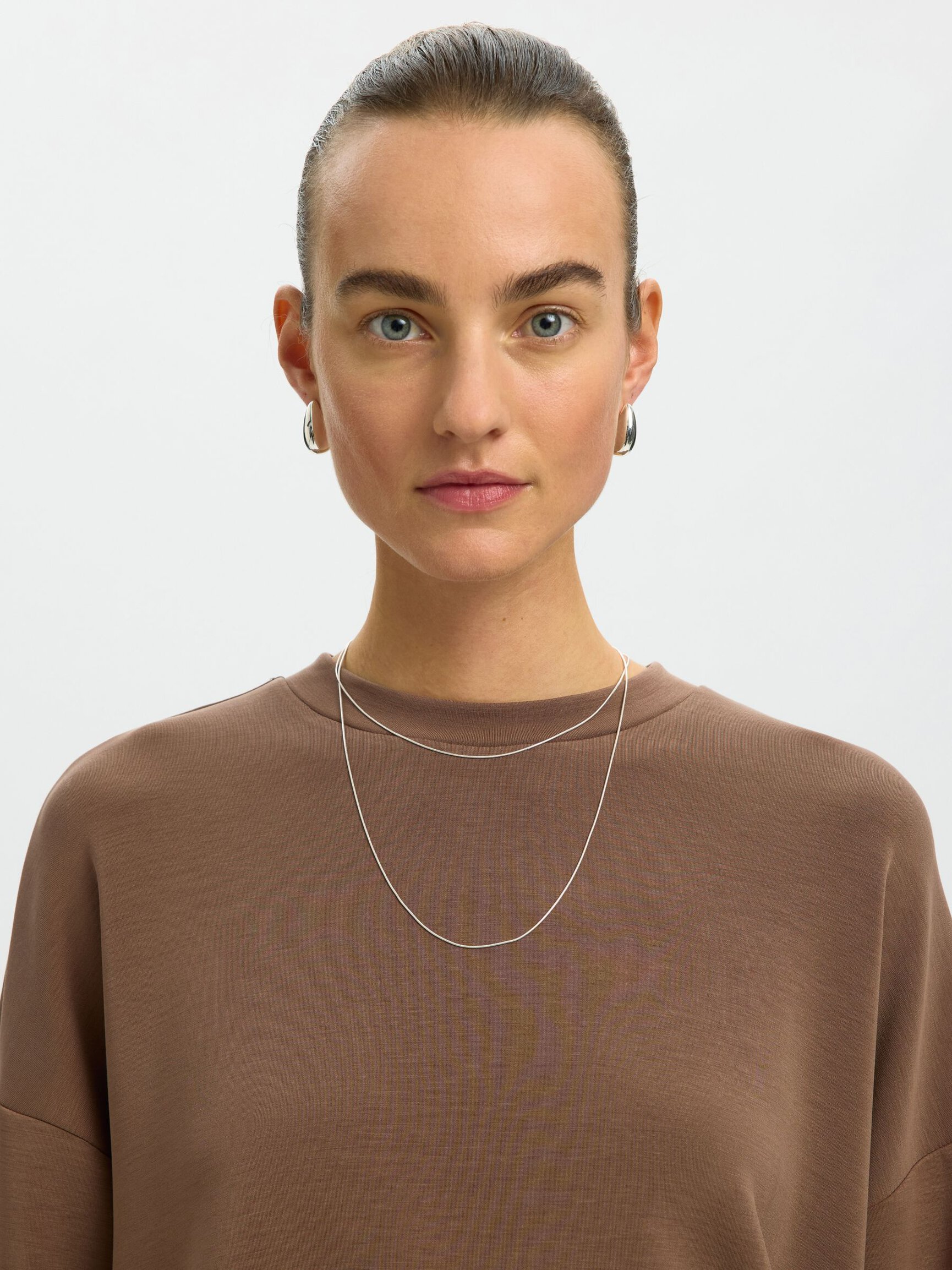 OVERSIZED TOP MET LANGE MOUWEN