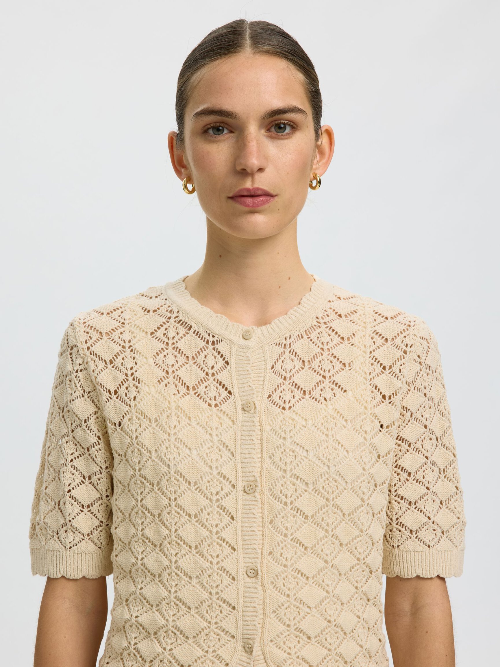 PRENDA DE MANGA CORTA CHAQUETA DE PUNTO